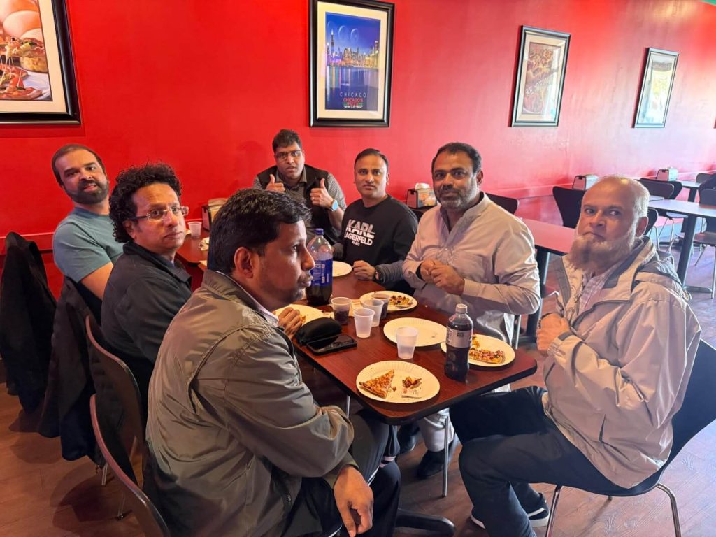 Group of men enjoying Indian pizza in El Dorado Hills at a restaurant.